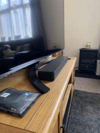 Fits between the stand , Bose TV Speaker