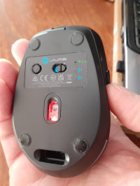 Underside showing on/off switch, connect button and storage for wifi dongle