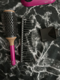 The brushes are amazing it comes with , Dyson Toy Hairdryer and Straighteners Set