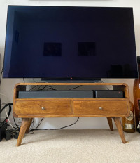 Sound bar fits neatly under the tv next to the tv box , Bose TV Speaker