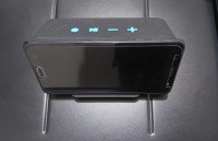 Smartphone holder with a 5W wireless charging surface. , Acoustic Solutions Podium