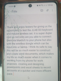 Photo of what has been typed out on the keyboard and mouse shown on screen on my phone , JLab GO